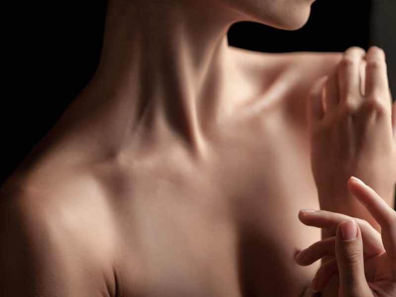 The close-up of a young woman’s neck
